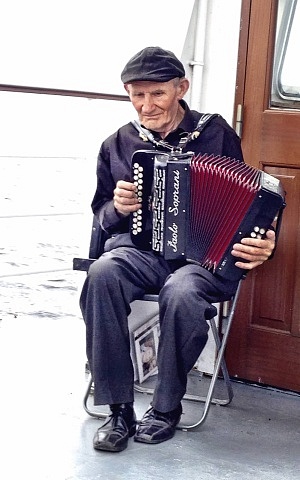 Accordion player on ferry boat who was an extra in The Quiet Man back in 1951 - Cong, Ireland