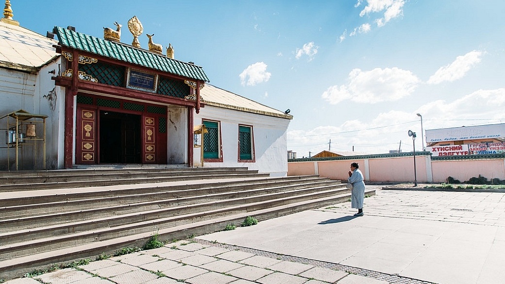 Woman praying Gandan Monastery in Ulaanbaatar, Mongolia