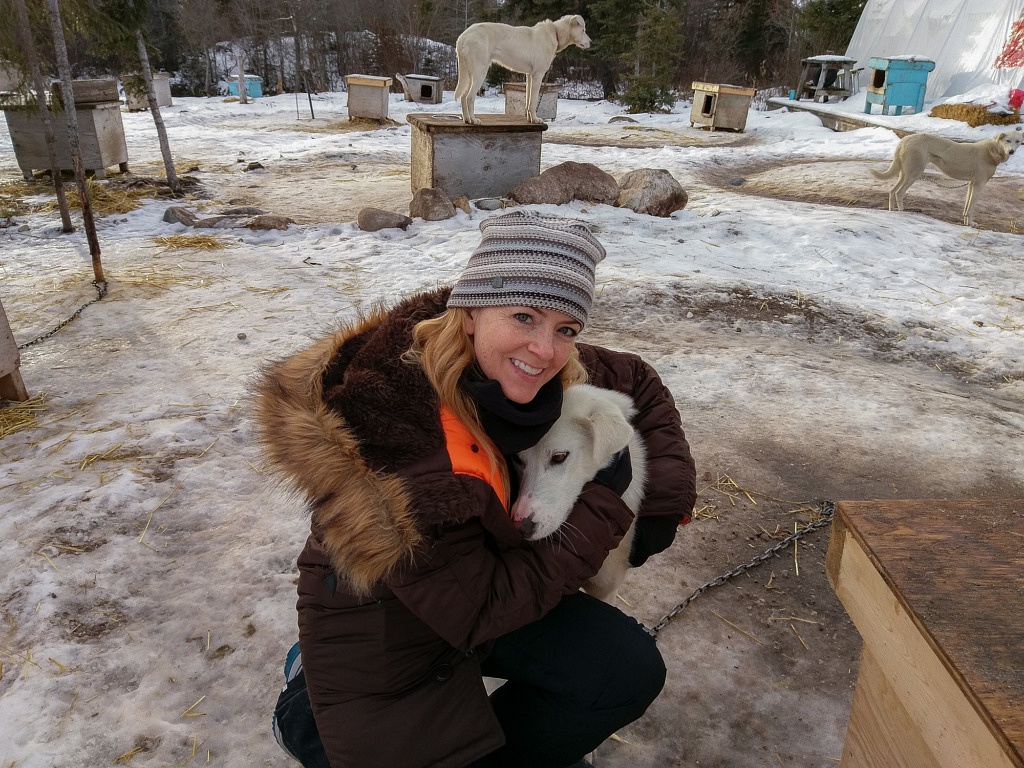 Juliana Dever hugging dog - Churchill Manitoba